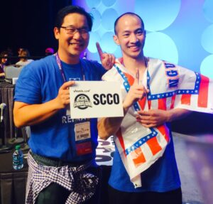 SCCO Dean of Optometry Dr. Stanley Woo congratulates David on his victory.