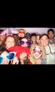 UHCO first year students enjoying the photo booth at Back to the 80's.