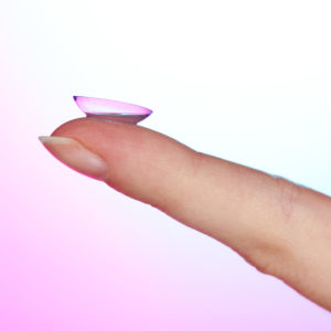 Contact lens on finger 